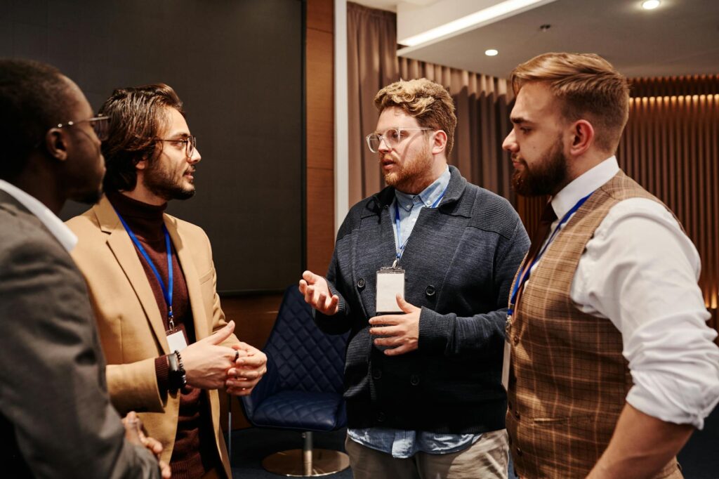 pexels-photo-8349431-8349431 A diverse group of professionals engaged in a business meeting discussion indoors.